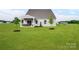 Expansive backyard with a well-maintained lawn and mature trees, providing ample space at 508 Kenyon Dr, Denver, NC 28037