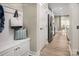 Hallway features wood flooring, a built-in bench with storage, and leads to the kitchen area at 508 Kenyon Dr, Denver, NC 28037