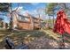 Brick home exterior featuring a deck, sunroom, and backyard with mature trees at 5101 Belicourt Dr, Charlotte, NC 28277