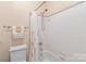 The secondary bathroom includes a white tub with tile surround and chrome fixtures at 5101 Belicourt Dr, Charlotte, NC 28277