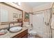 The bathroom features a vanity with granite countertop, bathtub with shower, and classic finishes at 5101 Belicourt Dr, Charlotte, NC 28277