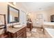 This bathroom has double sinks, tile flooring, and a large soaking tub at 5101 Belicourt Dr, Charlotte, NC 28277