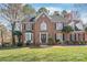 Charming brick home features manicured landscaping, symmetrical windows, and a welcoming front entrance at 5101 Belicourt Dr, Charlotte, NC 28277