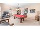 Spacious game room with a pool table, TV, and wall decor for entertainment at 5101 Belicourt Dr, Charlotte, NC 28277