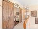 Hallway with sliding barn doors and a view to other rooms at 5101 Belicourt Dr, Charlotte, NC 28277