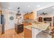 Kitchen boasts granite countertops, wooden cabinetry, stainless steel appliances and decorative pot rack at 5101 Belicourt Dr, Charlotte, NC 28277