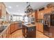 Spacious kitchen with an island, granite countertops, stainless steel appliances, and wooden cabinetry at 5101 Belicourt Dr, Charlotte, NC 28277