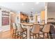Open kitchen features granite countertops, stainless steel appliances, and seating at the breakfast bar at 5101 Belicourt Dr, Charlotte, NC 28277