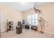 Functional home office with computer setup, shelving, and natural light at 5101 Belicourt Dr, Charlotte, NC 28277