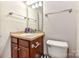 Well-lit bathroom with a vanity, mirror, towel rack, and toilet for everyday convenience at 599 Sixth Baxter Xing, Fort Mill, SC 29708