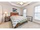 This bedroom features natural light, a modern ceiling fan, and neutral carpet at 599 Sixth Baxter Xing, Fort Mill, SC 29708