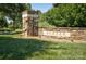 Stone monument sign at the entrance of the Baxter community set amongst green lawns at 599 Sixth Baxter Xing, Fort Mill, SC 29708