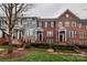 Beautiful townhomes feature brick facades, manicured landscaping, and inviting entryways at 599 Sixth Baxter Xing, Fort Mill, SC 29708