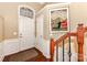Bright foyer featuring a beautiful staircase, elegant trim, and a well-lit entrance at 599 Sixth Baxter Xing, Fort Mill, SC 29708