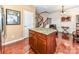 The kitchen features a granite island, hardwood floors and flows into a living space at 599 Sixth Baxter Xing, Fort Mill, SC 29708