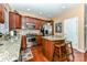Functional kitchen featuring an island, stainless steel appliances, and wood cabinetry at 599 Sixth Baxter Xing, Fort Mill, SC 29708