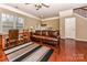 Spacious living room with hardwood floors, natural light, comfortable seating, and a ceiling fan at 599 Sixth Baxter Xing, Fort Mill, SC 29708