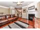 Cozy living room with hardwood floors, fireplace, staircase, and comfortable seating at 599 Sixth Baxter Xing, Fort Mill, SC 29708