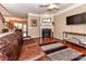 Inviting living room featuring a fireplace, hardwood floors, comfortable seating, and staircase at 599 Sixth Baxter Xing, Fort Mill, SC 29708