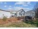 Cozy backyard with a greenhouse, patio dining set, and meticulous landscaping for tranquil outdoor living at 7200 Morning Dew Ct, Denver, NC 28037