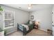 Comfortable bedroom with a twin-size bed, neutral walls, and a window with blinds, creating a relaxing atmosphere at 7200 Morning Dew Ct, Denver, NC 28037