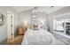 Bright bedroom with a ceiling fan, and a cozy queen-size bed with stylish side tables and lamps at 7200 Morning Dew Ct, Denver, NC 28037