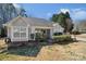 Charming single-story home featuring a well-manicured front yard with mature landscaping and a welcoming front porch at 7200 Morning Dew Ct, Denver, NC 28037