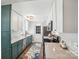 Modern kitchen with stainless steel appliances, ample cabinet space, and stone countertops at 7200 Morning Dew Ct, Denver, NC 28037