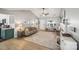 Open-concept living room with a fireplace, hardwood floors, and natural light at 7200 Morning Dew Ct, Denver, NC 28037