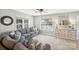 Comfortable living room featuring a large sectional sofa, hardwood floors, and natural light at 7200 Morning Dew Ct, Denver, NC 28037