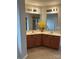 Bathroom featuring a double sink vanity with granite countertops, tile floor, and glass door shower at 8833 Goldfields Dr, Charlotte, NC 28227