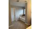 Spacious bathroom featuring a soaking tub, tile floors, and neutral wall color at 8833 Goldfields Dr, Charlotte, NC 28227