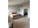 Primary bedroom featuring neutral colors, a large bed, and an attached sitting room at 8833 Goldfields Dr, Charlotte, NC 28227