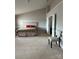 Large primary bedroom with plush carpeting, a tray ceiling, and attached sitting room at 8833 Goldfields Dr, Charlotte, NC 28227