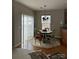 Cozy dining area with a round table set, natural lighting and access to the outdoors through sliding doors at 8833 Goldfields Dr, Charlotte, NC 28227