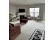 Bright living room with fireplace, neutral carpeting, and comfortable seating at 8833 Goldfields Dr, Charlotte, NC 28227