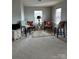 Sitting room featuring neutral colors, a rug, and views of the exterior at 8833 Goldfields Dr, Charlotte, NC 28227