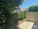 Backyard view showing a privacy fence, patio, and lush greenery at 1019 Archibald Ave, Fort Mill, SC 29708