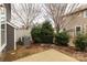 Backyard with a concrete patio, greenery, and views of surrounding residences at 1019 Archibald Ave, Fort Mill, SC 29708