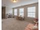 Spacious bonus room with carpet, multiple windows, and ample space for various activities at 1019 Archibald Ave, Fort Mill, SC 29708