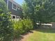 View of the exterior with horizontal siding, white trim, and mature trees for shade at 1019 Archibald Ave, Fort Mill, SC 29708