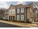 Charming multi-level townhome with stone accents and well-maintained landscaping at 1019 Archibald Ave, Fort Mill, SC 29708