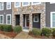 Inviting covered front porch with stone accents and a welcoming entrance mat at 1019 Archibald Ave, Fort Mill, SC 29708