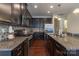 Gourmet kitchen featuring granite counters, stainless steel appliances, and hardwood flooring at 1019 Archibald Ave, Fort Mill, SC 29708