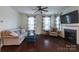 Comfortable living room with hardwood floors, a fireplace, and ample natural light at 1019 Archibald Ave, Fort Mill, SC 29708