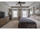 Spacious main bedroom with tray ceiling and multiple windows provides a light-filled and airy ambiance at 1019 Archibald Ave, Fort Mill, SC 29708
