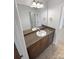 Bathroom featuring a granite countertop, and a large framed mirror at 111 Chaffee Pl, Mooresville, NC 28115