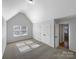 Bright bedroom with vaulted ceiling, carpeted floors, and double door closet at 111 Chaffee Pl, Mooresville, NC 28115