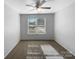 Inviting bedroom with neutral carpet, a ceiling fan, and an abundance of natural light at 111 Chaffee Pl, Mooresville, NC 28115