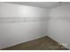Walk-in closet with carpet and wire shelving for storage at 111 Chaffee Pl, Mooresville, NC 28115
